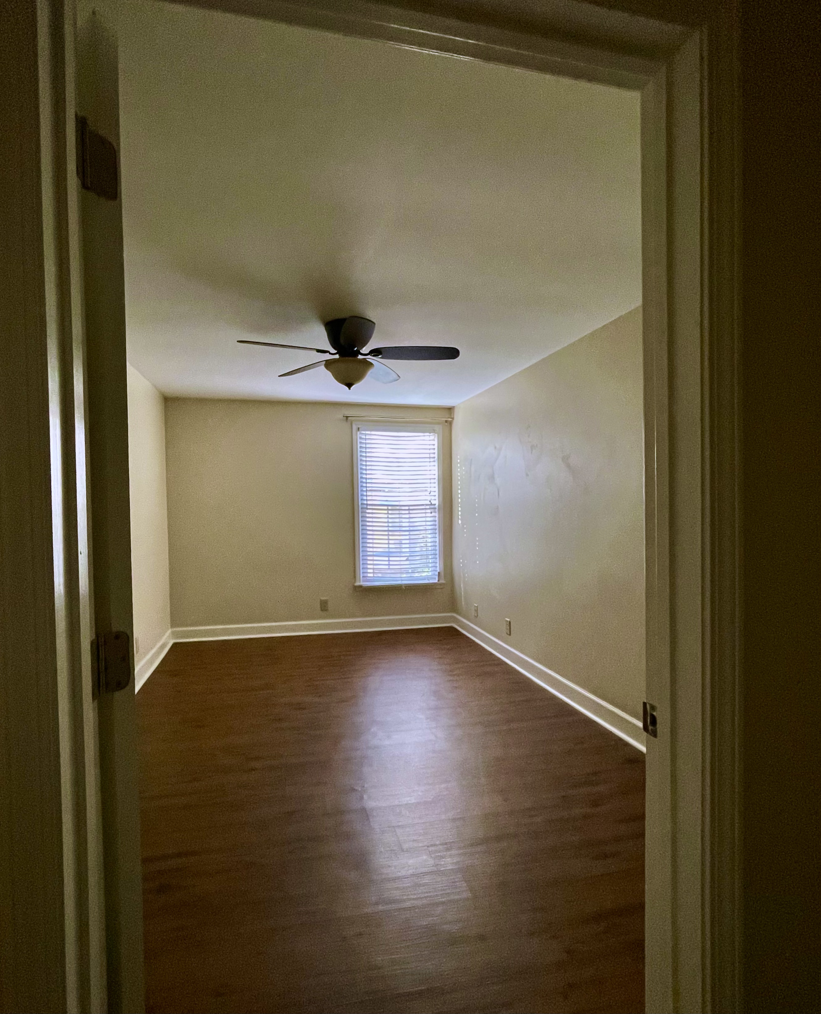 Bedroom 1 looking toward doors to hall, ensuite bath and walk-in closet